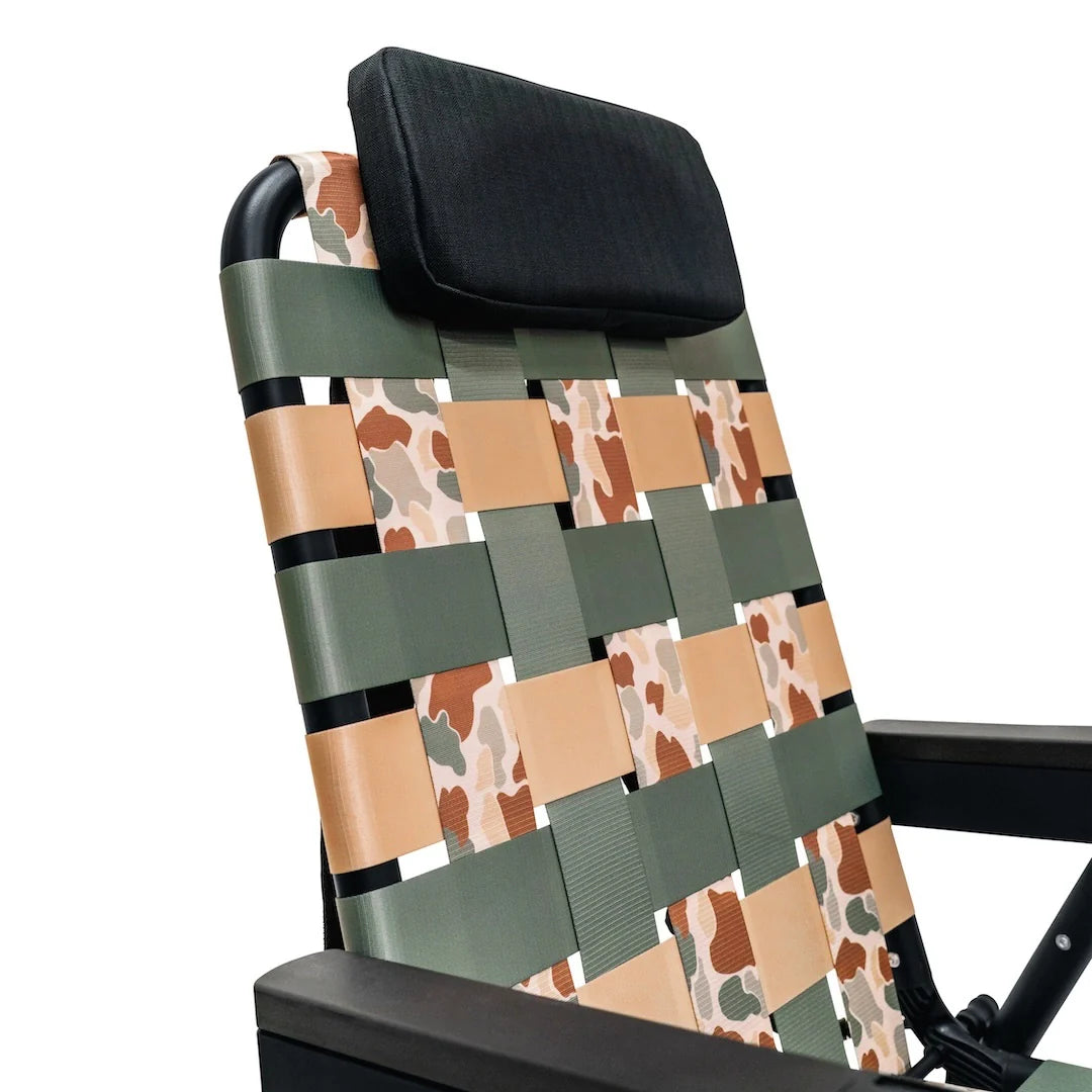 Close-up of the PARKIT Free Fly Eclipse Recliner in Vintage Camo pattern, showing woven webbing detail and padded headrest. The best folding outdoor chair for dads, moms, campers, and beachgoers, built for comfort, durability, and timeless style with a rugged camo design that fits everywhere from backyard hangs to weekend adventures.
