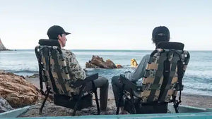 Two guys wearing hats sat in PARKIT Camo chairs