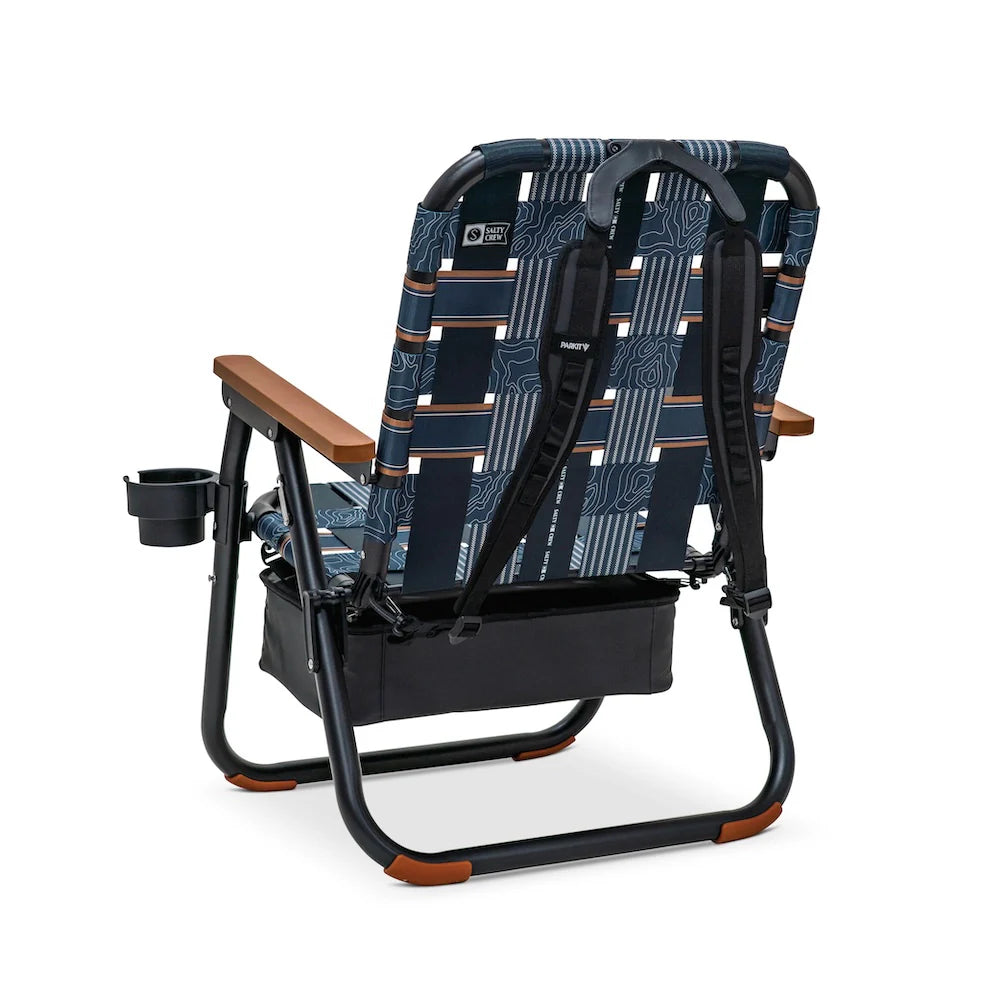 PARKIT x Salty Crew Voyager Chair in limited-edition topo-map pattern, featuring woven webbing, black steel frame, wooden armrests, built-in cooler, cup holder, and backpack straps, rugged 3-in-1 outdoor chair built for surf, fish, and adventure.